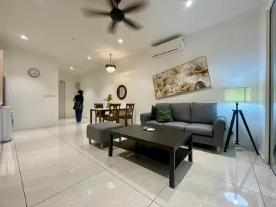 a living room with a couch and a table at Quill Residences KLCC By ONZO in Kuala Lumpur