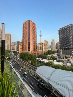 a view of a city with a highway and buildings at Quill Residences KLCC By ONZO in Kuala Lumpur