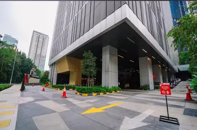 a building with orange cones in front of it at Imperial KLCC by WSD in Kuala Lumpur