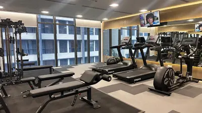 a gym with treadmills and cardio equipment in a building at Imperial KLCC by WSD in Kuala Lumpur