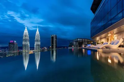 a view of the kuala lumpur city skyline at night at Imperial KLCC by WSD in Kuala Lumpur