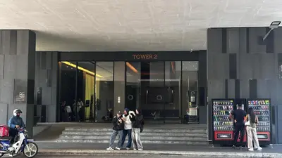 a group of people standing in front of a store at Opus Kuala Lumpur by WSD in Kuala Lumpur
