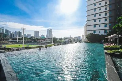 a pool of water in the middle of a city at Opus Kuala Lumpur by WSD in Kuala Lumpur