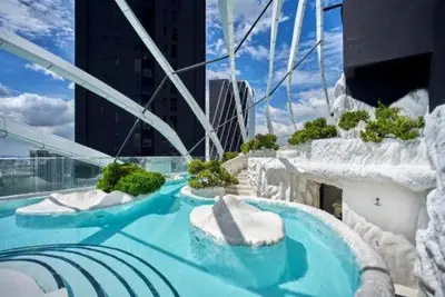 a water slide on top of a building at Arte Mont Kiara by CozyVista Suites in Kuala Lumpur