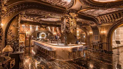 a bar in a building with an ornate ceiling at Arte Mont Kiara by CozyVista Suites in Kuala Lumpur