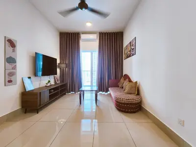 a living room with a couch and a tv at RC Residence 6 pax by Define Suite in Kuala Lumpur