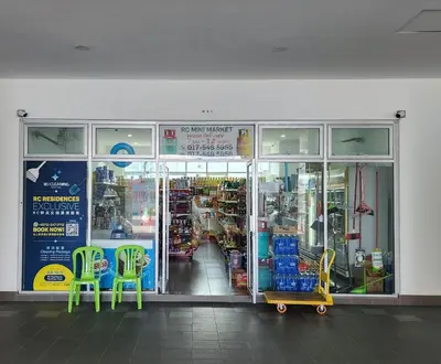 a store front with two green chairs in a store at RC Residence 6 pax by Define Suite in Kuala Lumpur