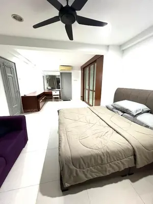 a bedroom with a bed and a ceiling fan at Apartment in bukit bintang in Kuala Lumpur
