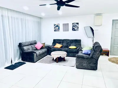 a living room with two couches and a table at Apartment in bukit bintang in Kuala Lumpur