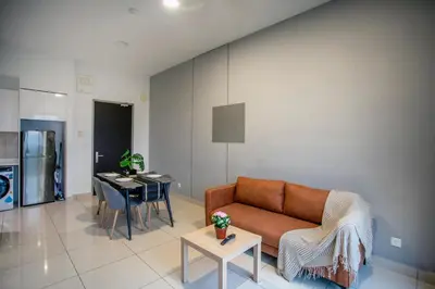 a living room with a couch and a table at Astoria Ampang Modern 2Bedroom Suite Free Parking in Kuala Lumpur
