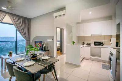 a kitchen and dining room with a table and chairs at Astoria Ampang Modern 2Bedroom Suite Free Parking in Kuala Lumpur
