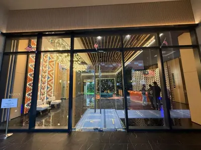 a store front with people walking into a building at Royale Suites At Majestic Residence KL in Kuala Lumpur