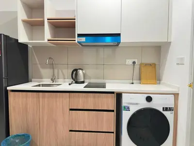 a kitchen with a dishwasher and a sink at Luxury couple suite 307A at Majestic Residence in Kuala Lumpur