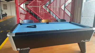 a pool table in the middle of a room at Private family suite 1113A1BR at Majestic Residence in Kuala Lumpur