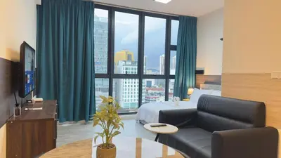 a hotel room with a bed and a large window at Private family suite 1113A1BR at Majestic Residence in Kuala Lumpur