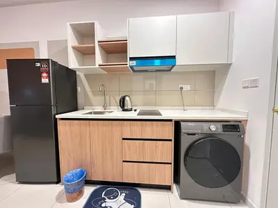 a kitchen with a black refrigerator and a dishwasher at Luxury suite for couple 267A at KLCC in Kuala Lumpur