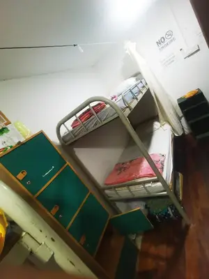 a room with a shelf with at Moonlight Inn Bukit Bintang in Kuala Lumpur