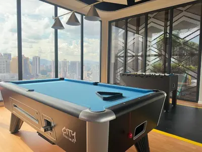 a pool table in a room with a view at Luxury suite 293A at KLCC in Kuala Lumpur