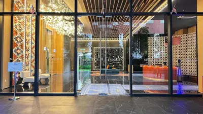 a store front with glass doors in a building at Cozy couple suite 23A3B at KLCC in Kuala Lumpur