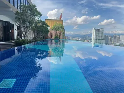 a large swimming pool with a view of a city at Cozy couple suite 23A3B at KLCC in Kuala Lumpur