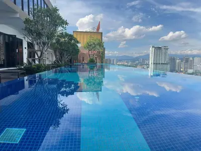 a large swimming pool with a view of a city at Couple suite 291A at KLCC in Kuala Lumpur