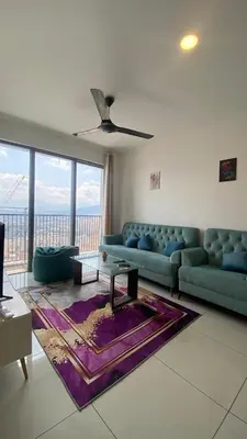 a living room with a blue couch and a large window at COZY Kenwingston The platz Setapak 3BR&2BR 5-8PAX FREE WIFI PARKIN NETFLIX 3306 in Kuala Lumpur