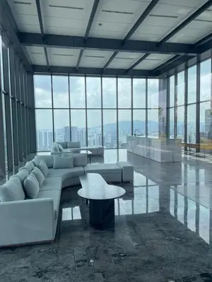 a living room with a white couch and a table at COZY Kenwingston The platz Setapak 3BR&2BR 5-8PAX FREE WIFI PARKIN NETFLIX 3306 in Kuala Lumpur