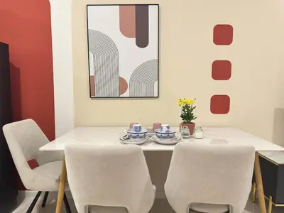 a dining room with a white table and chairs at KLCC view couple suite 277B at KLCC in Kuala Lumpur