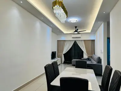 a dining room with a table and chairs and a couch at Sentul Home Condo-KLCC View with 3bed,3bath, cooking allowed in Kuala Lumpur