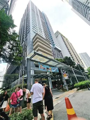 a group of people standing in front of a building at Mercu Summer Suites KLCC By ATIQ in Kuala Lumpur