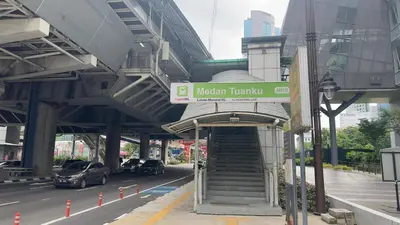 a metro train station with stairs and a sign at Private family suite 29171BR at KLCC in Kuala Lumpur