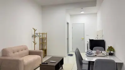 a living room with a couch chair and a table at Cozy couple suite 232B at Majestic Residence in Kuala Lumpur