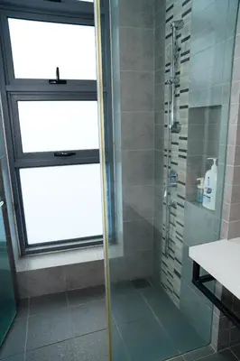 a shower with a glass door in a bathroom at Bukit Bintang Robertson Residences, KLCC in Kuala Lumpur