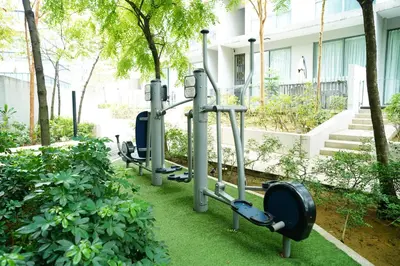 a row of gym equipment in front of a building at Bukit Bintang Robertson Residences, KLCC in Kuala Lumpur