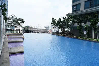 a large swimming pool in the middle of a city at Bukit Bintang Robertson Residences, KLCC in Kuala Lumpur