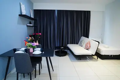 a living room with a couch and a table at Bukit Bintang Robertson Residences, KLCC in Kuala Lumpur