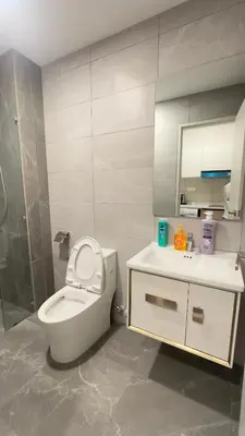 a bathroom with a toilet and a sink and a mirror at KLCC view studio suite 272B at KLCC in Kuala Lumpur