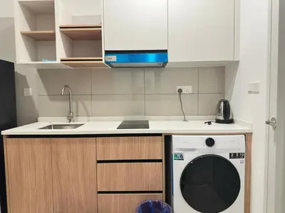 a kitchen with a washing machine and a sink at Cozy suite for couple 297A at KLCC in Kuala Lumpur