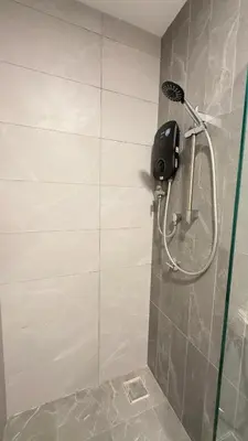 a shower in a bathroom with a shower at Private family suite 27171BR at KLCC in Kuala Lumpur