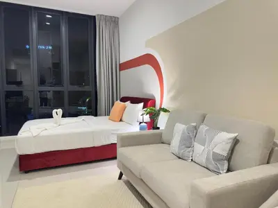 a living room with a bed and a couch at Cozy KLCC view suite 305B at KLCC in Kuala Lumpur