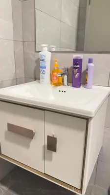 a white bathroom sink with toiletries on it at KLCC view couple suite 292A at Majestic residence in Kuala Lumpur