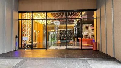 an entrance to a building with a glass door at Luxe suite for couple 297B at Majestic Residence in Kuala Lumpur
