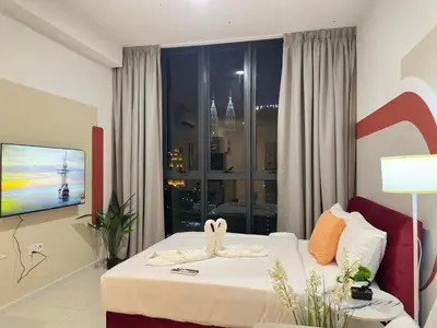 a hotel room with a bed and a window at Luxe suite for couple 297B at Majestic Residence in Kuala Lumpur