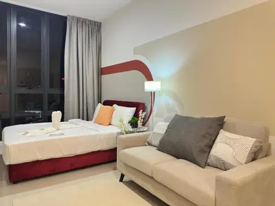 a bedroom with a bed and a couch at Luxe suite for couple 297B at Majestic Residence in Kuala Lumpur