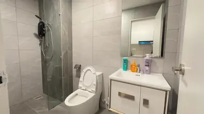 a bathroom with a toilet and a sink and a shower at Couple luxury suite 275B at Majestic Residence in Kuala Lumpur