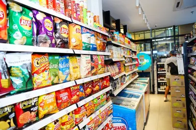 a store aisle filled with lots of different types of snacks at Scarletz Suites By Home Stay in Kuala Lumpur