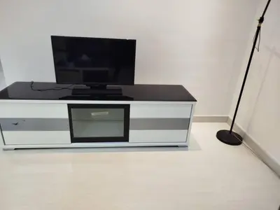 a flat screen tv sitting on top of a entertainment center at Binjai 8 Comfort Hospitality in Kuala Lumpur