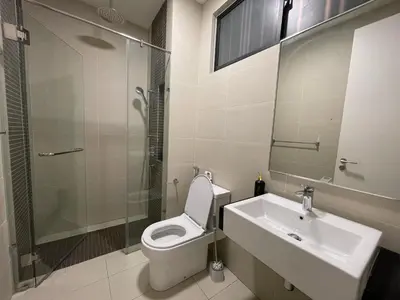 a bathroom with a toilet and a sink and a shower at Sentral Suites KL Sentral Kuala Lumpur by Nestaway in Kuala Lumpur