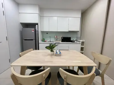 a kitchen with a table and chairs in a room at Sentral Suites KL Sentral Kuala Lumpur by Nestaway in Kuala Lumpur