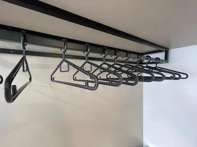 a rack of cooking utensils hanging on a wall at The Riv Riveria City KL Sentral Kuala Lumpur by Nestaway in Kuala Lumpur